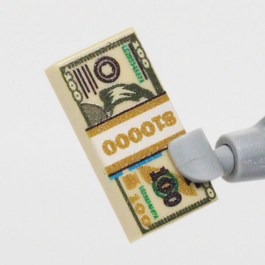Custom printed 10K Bill Stack LEGO part by BrickTactical, showcasing detailed currency design for your builds.