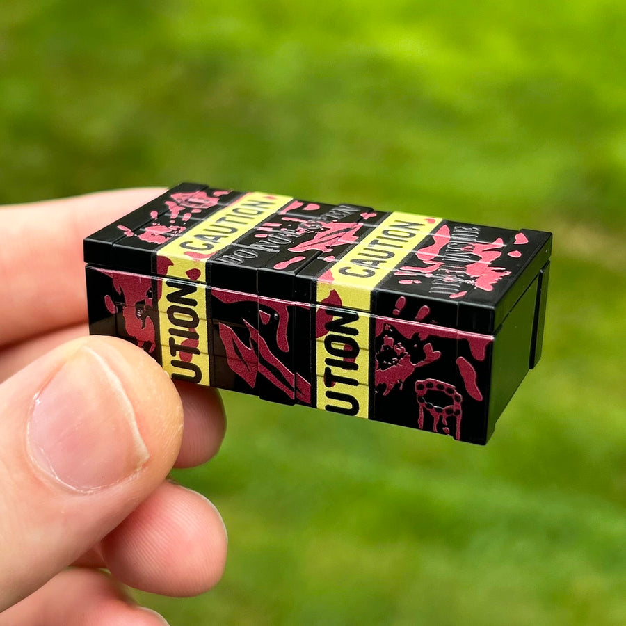 Zombie Head Crate in Black by BrickTactical, closed crate in hand