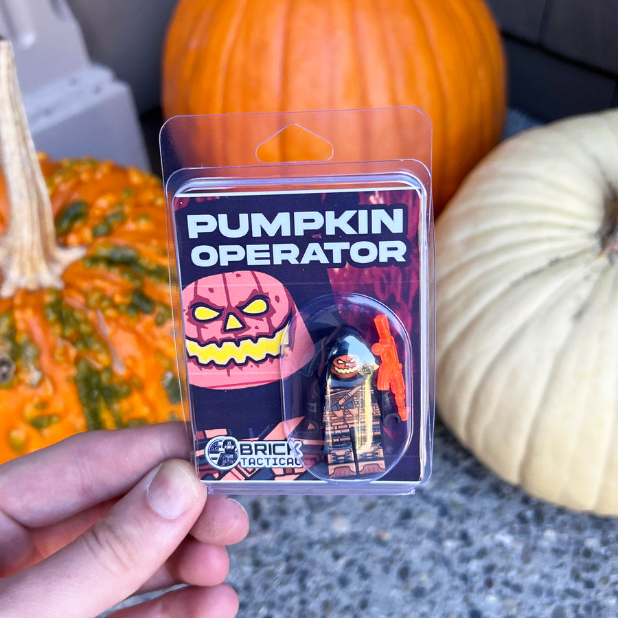 Pumpkin Operator custom LEGO minifigure by BrickTactical in packaging with Halloween pumpkins